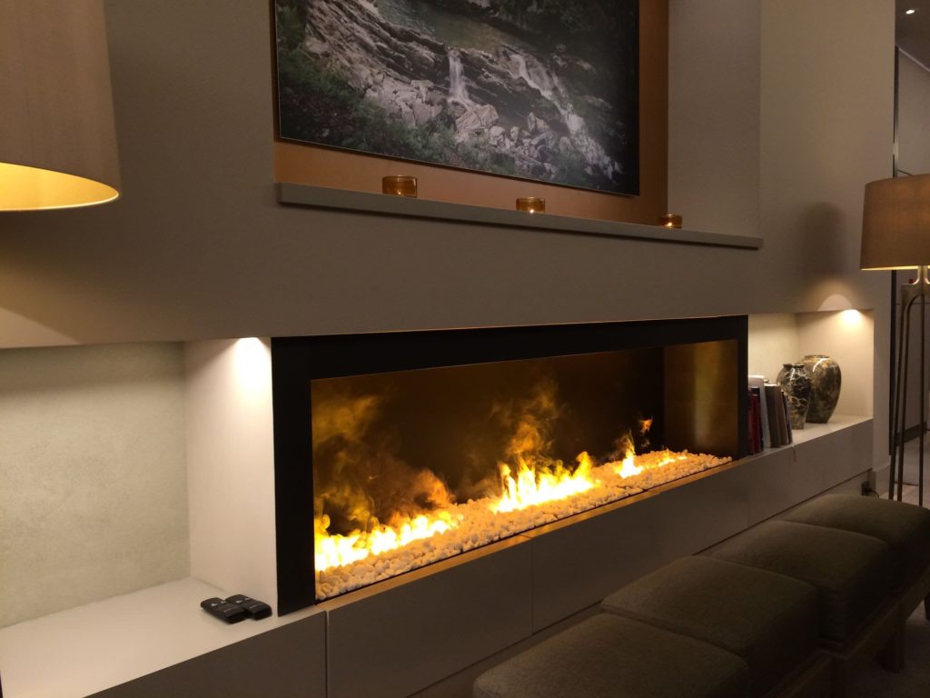 EVA Furniture - An electric fireplace is an electric heater that mimics a fireplace burning coal