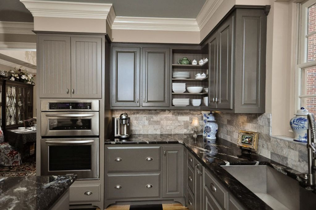 grey-kitchen-cabinets-with-patterned-black-granite-countertop
